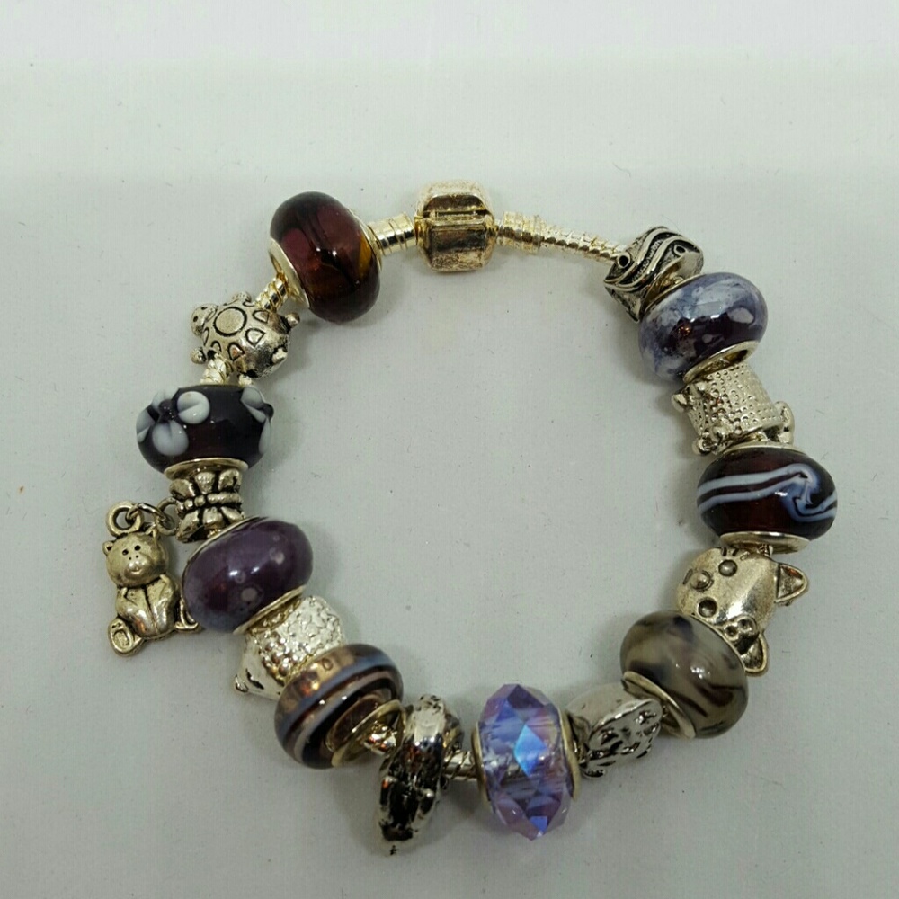 Animal theme charm bracelet with purple beads
